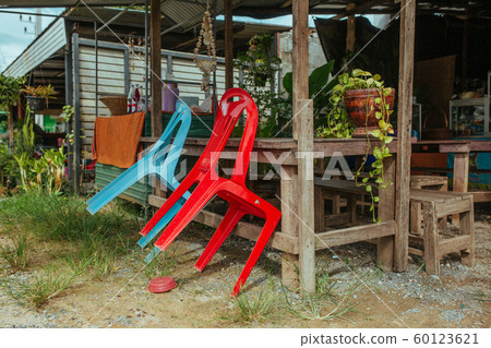 Plastic chairs on the street in summer Asia 60123621