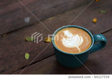 hot latte coffee drink put on wooden table in the morning day hot latte coffee drink put on wooden table in the morning day 60127339
