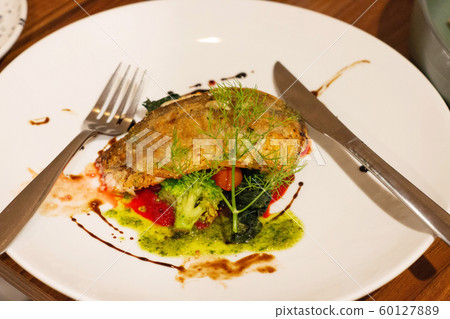 seabass filet on white plate seabass filet on white plate 60127889