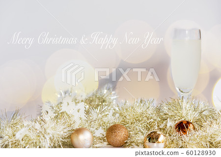Merry Christmas. Champagne in glasses celebrating Merry Christmas. Champagne in glasses celebrating 60128930