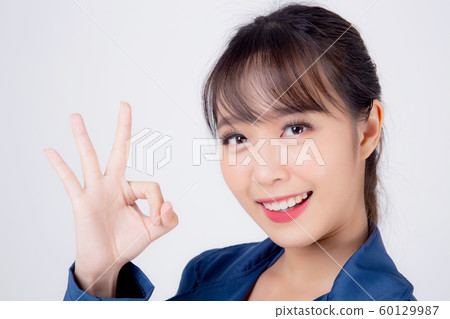 beautiful portrait young business asian woman standing gesture ok sign with confident 60129987