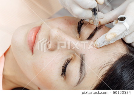 Permanent makeup, tattooing of eyebrows 60130584