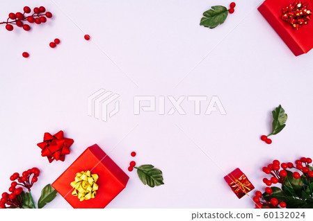 Christmas decoration. red gift box on purple background. Christmas, winter, new year concept Christmas decoration. red gift box on purple background. Christmas, winter, new year concept 60132024
