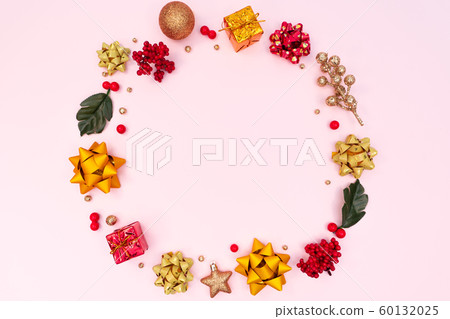 Christmas wreath on pink background. Christmas decoration. Flat lay, top view, copy space Christmas wreath on pink background. Christmas decoration. Flat lay, top view, copy space 60132025