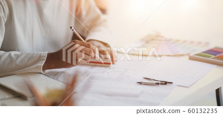 Close-up view of young professional architect Close-up view of young professional architect 60132235