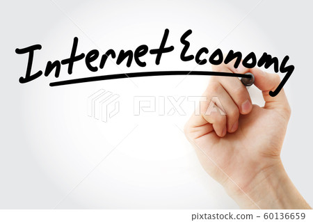 Hand writing Internet economy with marker 60136659