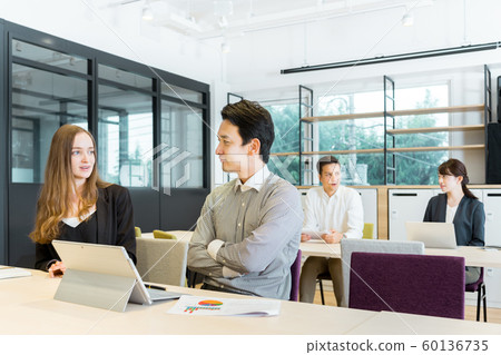 4 men and women working in the office (people of different races) 4 men and women working in the office (people of different races) 60136735