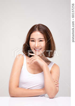 Beautiful Young Asian Woman with short hair Looking While Touching Chin feeling so happy and cheerful with healthy Clean and Fresh skin,isolated on white background,Beauty Cosmetics Concept Beautiful Young Asian Woman with short hair Looking While Touching Chin feeling so happy and cheerful with healthy Clean and Fresh skin,isolated on white background,Beauty Cosmetics Concept 60137256