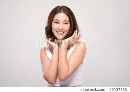 Beautiful Asian woman with short hair looking at camera smile with clean and fresh skin Happiness and cheerful with positive emotional,isolated on gray background,Beauty and Cosmetics Concept 60137260