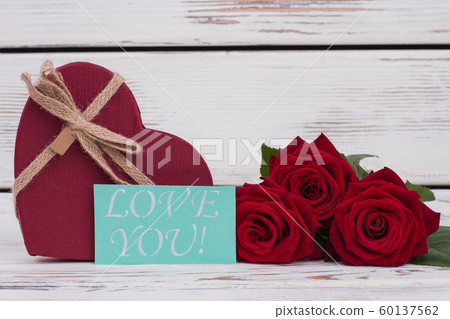 Valentine holiday gift and roses. 60137562
