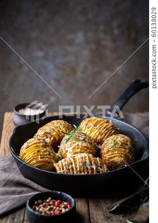 Baked hasselback potatoes 60138029