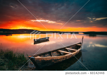 Braslaw Or Braslau, Vitebsk Voblast, Belarus. Wooden Rowing Fishing Boats In Beautiful Summer Sunset On The Dryvyaty Lake. This Is The Largest Lake Of Braslav Lakes. Typical Nature Of Belarus 60142448