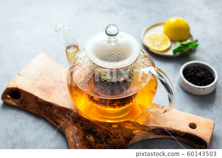 Tea in glass tea pot 60143503