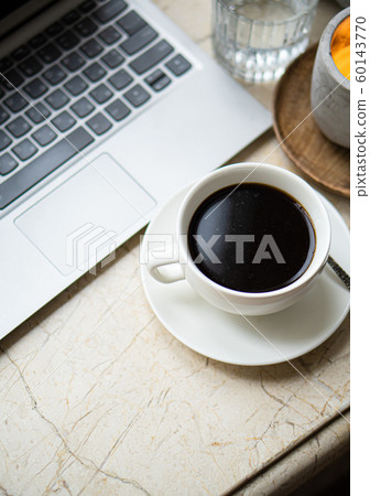 Cozy freelancer's winter work place at home with cup of coffee Cozy freelancer's winter work place at home with cup of coffee 60143770