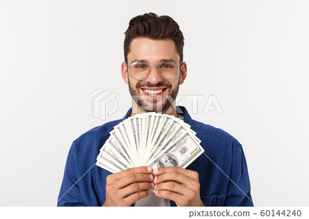 Attractive man is holding cash money in one hand, on isolated white background Attractive man is holding cash money in one hand, on isolated white background 60144240