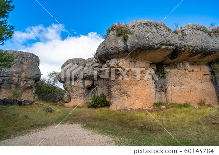 Unique rock formations in La Ciudad Encantada or Enchanted City natural park near Cuenca, Castilla la Mancha, Spain. Unique rock formations in La Ciudad Encantada or Enchanted City natural park near Cuenca, Castilla la Mancha, Spain. 60145784