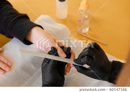 Nails manicure with file. Nail filing.  60147386
