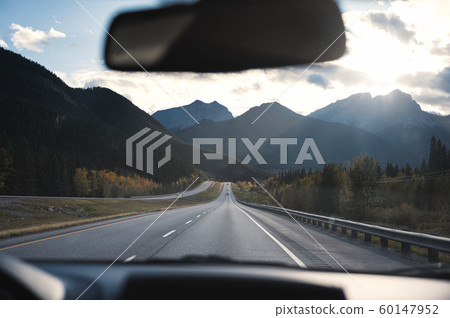 Scenic road trip with sunshine on canadian rockies 60147952