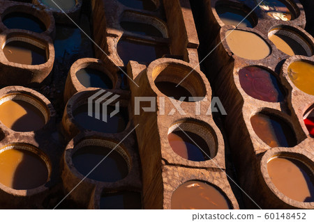 Chouara tannery in old medina in Fes, a traditional and old tannery with workers working making methods of leather in the city Fes, Morocco 60148452