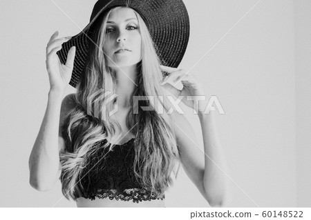 beautiful girl in a hat with a brim fashion beautiful girl in a hat with a brim fashion 60148522