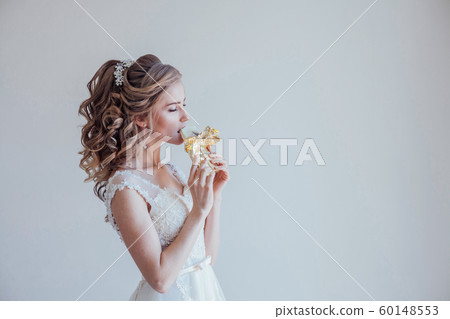the bride at a wedding in room eating white chocolate the bride at a wedding in room eating white chocolate 60148553