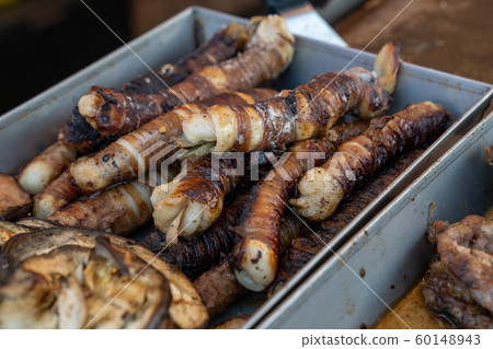 Stigghiola cooked in alimunio container at the Stigghiola cooked in alimunio container at the 60148943