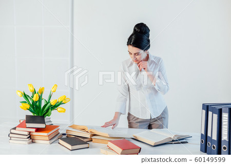 business girl sits in the Office paper folders Secretary 60149599