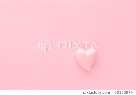 pastel pink background with a heart with copy space 60150076