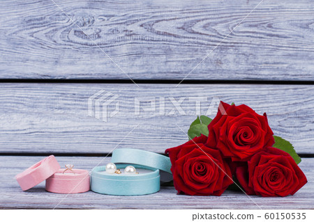 Boxes with jewelry and red roses. Boxes with jewelry and red roses. 60150535