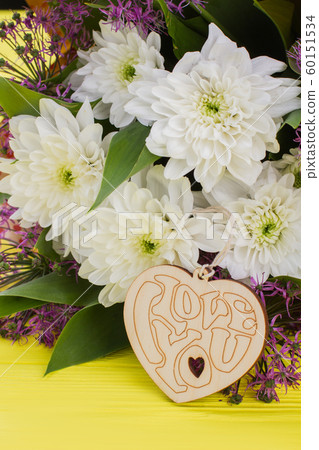 Flowers and wooden heart. 60151534