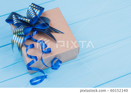 Brown craft box with blue striped ribbon bow. 60152140