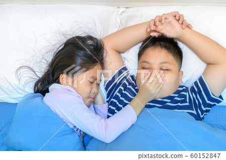 Annoying snoring. Sister covered her brother's 60152847