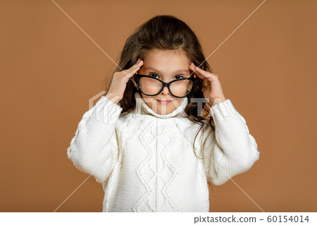 Cute curly little child girl in glasses Cute curly little child girl in glasses 60154014