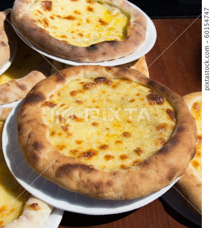 Turkish flat bread covered with cheese 60154747