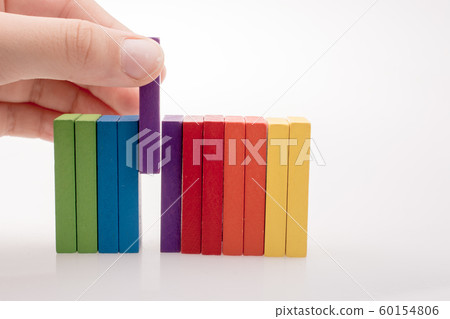 Hand holding color dominoes Hand holding color dominoes 60154806