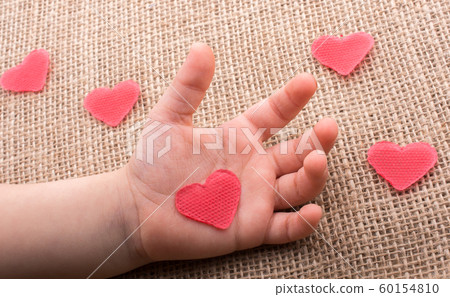 Heart shaped object in hand Heart shaped object in hand 60154810