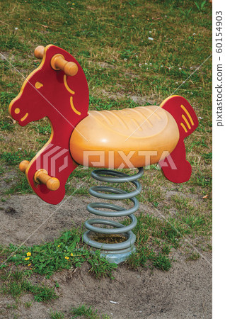 Toy horse for children in playground at Drimmelen Toy horse for children in playground at Drimmelen 60154903