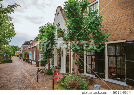 Charming and quiet street with brick rustic houses at Drimmelen Charming and quiet street with brick rustic houses at Drimmelen 60154904