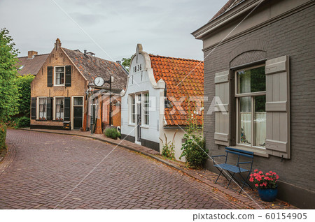 Charming and quiet street with brick rustic houses at Drimmelen Charming and quiet street with brick rustic houses at Drimmelen 60154905