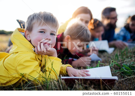 Group of school children with teacher on field trip in nature. Group of school children with teacher on field trip in nature. 60155011