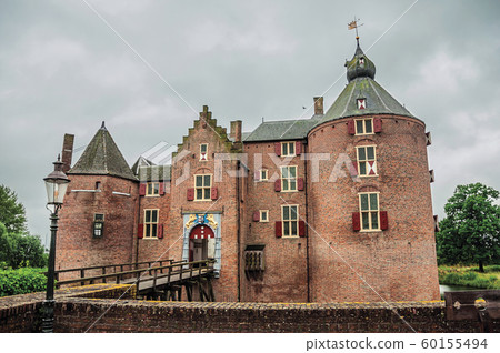Medieval Ammersoyen Castle with its brick towers 60155494