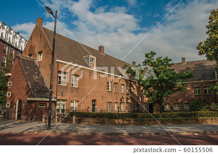 Street with brick houses and bicycles Street with brick houses and bicycles 60155506