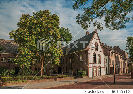 Street with large brick house in s-Hertogenbosch 60155510