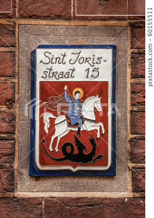 Street sign with enameled paint of Saint George and dragon 60155511