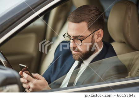 Man texting message during driving 60155642