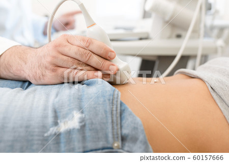 Close up of a doctor examines the internal organs Close up of a doctor examines the internal organs 60157666