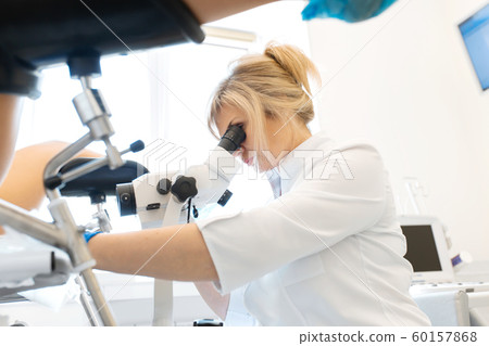 A gynecologist is examined by a patient who is 60157868