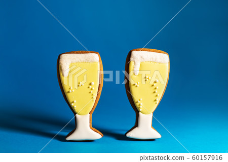 gingerbread cookie of champagne glass on blue gingerbread cookie of champagne glass on blue 60157916