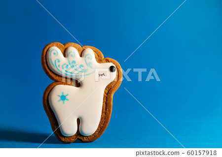 gingerbread cookie of cute deer on blue gingerbread cookie of cute deer on blue 60157918