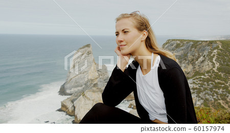 Sitting at the coast of Cabo da Roca in Portugal Sitting at the coast of Cabo da Roca in Portugal 60157974